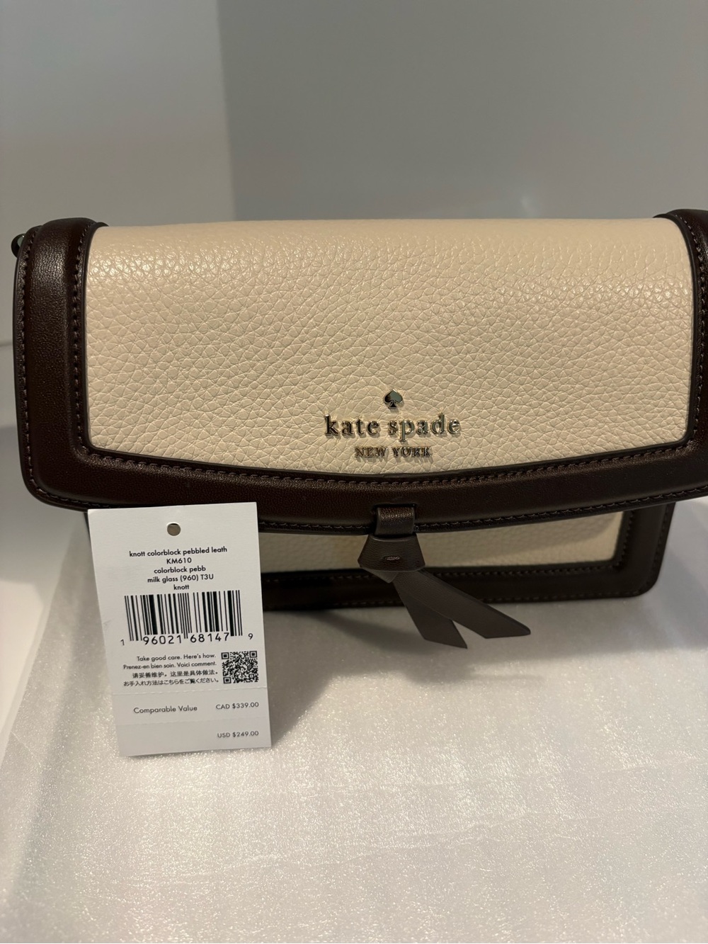 NWT Kate Spade cream & dark brown pebbled leather crossbody bag with bow accent